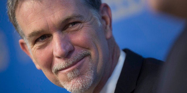 Reed Hastings, chairman, president and chief executive officer of Netflix Inc., smiles during a Broadcasting Board of Governors (BBG) panel discussion in Washington, D.C., U.S., on Wednesday, Dec. 18, 2013. Technology company executives including Hastings left a meeting with President Barack Obama yesterday with no commitment to limit government snooping on Internet traffic, according to an industry official briefed on the session. Photographer: Andrew Harrer/Bloomberg via Getty Images