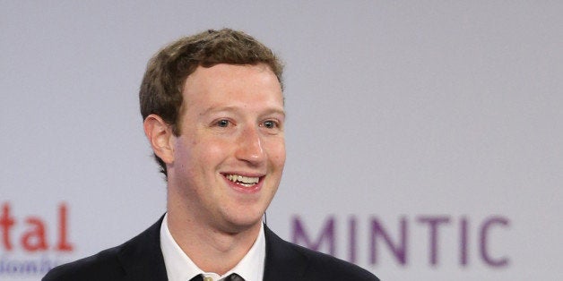 Facebook founder and CEO Mark Zuckerberg smiles during an event to launch in Colombia an app providing free basic Internet service via cellphone connections, in Bogota, Colombia, Wednesday, Jan. 14, 2015. (AP Photo/Fernando Vergara)