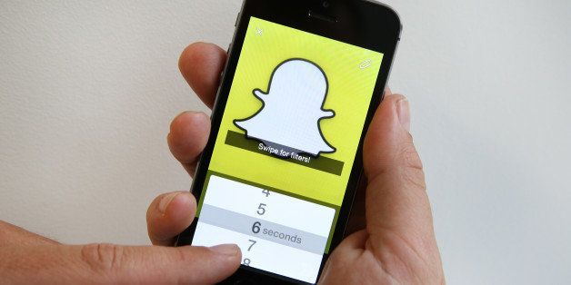 LONDON, ENGLAND - OCTOBER 06: In this photo illustration the Snapchat app is used on an iPhone on October 6, 2014 in London, England. Snapchat allows users' messages to vanish after seconds. It is being reported that Yahoo may invest millions of dollars in the start up firm. (Photo by Peter Macdiarmid/Getty Images)