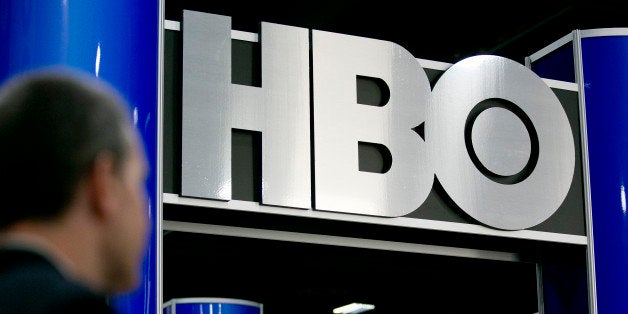 The logo of Home Box Office Inc. (HBO) is seen on the exhibit floor during the National Cable and Telecommunications Association (NCTA) Cable Show in Washington, D.C., U.S., on Tuesday, June 11, 2013. The Cable Show is expected to bring in more than 10,000 attendees with 286 companies on the exhibit floor. Photographer: Andrew Harrer/Bloomberg via Getty Images