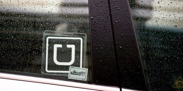 The Uber Technologies Inc. logo is displayed on the window of a vehicle after dropping off a passenger at Ronald Reagan Natio