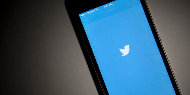 The Twitter Inc. application is displayed on an Apple Inc. iPhone 5s in this arranged photograph in Washington, D.C., U.S., o