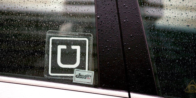The Uber Technologies Inc. logo is displayed on the window of a vehicle after dropping off a passenger at Ronald Reagan Natio