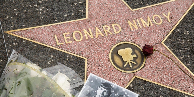 HOLLYWOOD - CA - FEBRUARY 27, 2015: Flowers and a photo are placed at Leonard Nimoy's star on the Walk of Fame on 6651Hollywood Blvd on February 27, 2015 in Hollywood, California. Leonard Nimoy, the actor best known for his portrayal of Mr. Spock, from Star Trek, died friday morning at his home in Bel Air. (Ricardo DeAratanha/LA Times via Getty Images