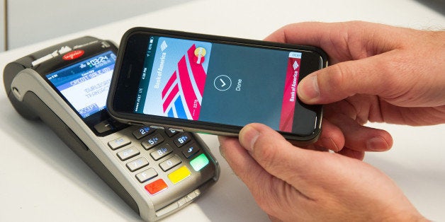 IMAGE DISTRIBUTED FOR MASTERCARD - MasterCard demonstrates Apple Pay at the launch of MasterCard's NYC Tech Hub on Monday, Oc