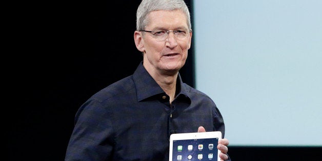 Apple CEO Tim Cook introduces the new Apple iPad Air 2 during an event at Apple headquarters on Thursday, Oct. 16, 2014 in Cupertino, Calif. (AP Photo/Marcio Jose Sanchez)