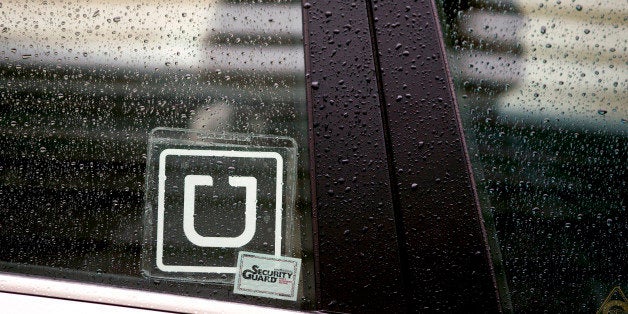 The Uber Technologies Inc. logo is displayed on the window of a vehicle after dropping off a passenger at Ronald Reagan Natio