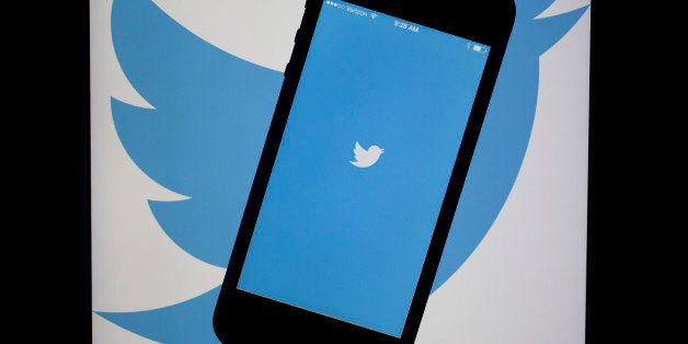 The Twitter Inc. application and logo are displayed on an Apple Inc. iPhone 5s and iPad Air in this arranged photograph in Washington, D.C., U.S., on Friday, April 25, 2014. Twitter Inc. is expected to release earnings figures on April 29. Photographer: Andrew Harrer/Bloomberg via Getty Images