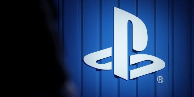 A logo for Sony Corp.'s PlayStation console sits illuminated on a wall during a news conference in Tokyo, Japan, on Monday, S