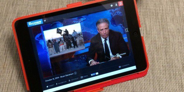 Watching The Daily Show on an iPad mini, with coffee 
