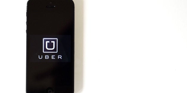 BARCELONA, SPAIN - JULY 01: In this photo illustration, the app 'Uber' is launched in a smart phone on July 1, 2014 in Barcelona, Spain. Taxi drivers in main cities strike over unlicensed car-halling services. Drivers say that is a lack of regulation behind the new app. (Photo Illustration by David Ramos/Getty Images)