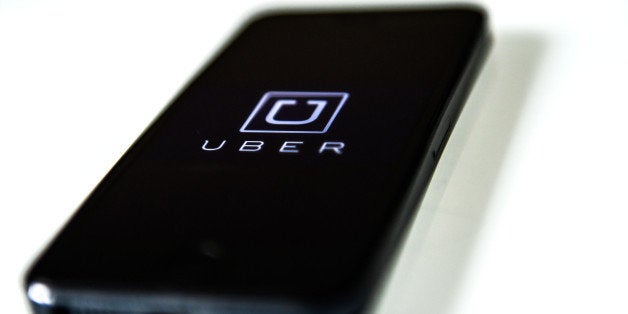 BARCELONA, SPAIN - JULY 01: In this photo illustration, the app 'Uber' is launched in a smart phone on July 1, 2014 in Barcelona, Spain. Taxi drivers in main cities strike over unlicensed car-halling services. Drivers say that is a lack of regulation behind the new app. (Photo Illustration by David Ramos/Getty Images)