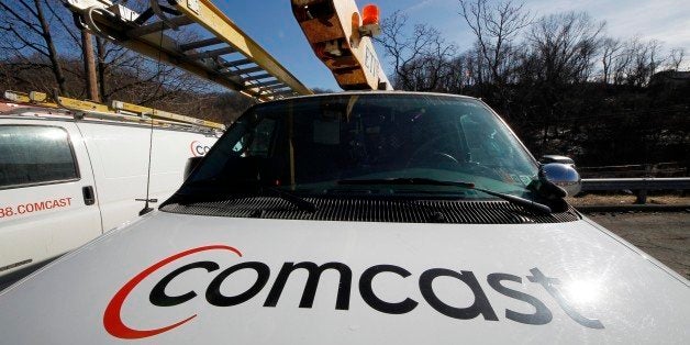 A Comcast logo is seen on a Comcast truck in Pittsburgh Tuesday, Feb. 15, 2011. (AP Photo/Gene J. Puskar)