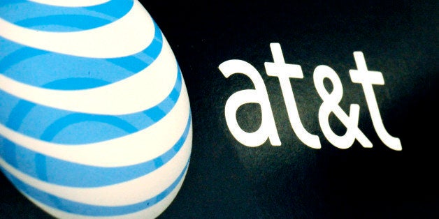 FILE - In this Oct. 19, 2009 file photo, the AT&T logo is on display at a RadioShack store in Gloucester, Mass. AT&T