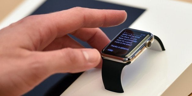 A customer plays with a new Apple Watch in an Apple store in Sydney on April 10, 2015. Apple started taking orders from customers before the sale of the watch which will be available to buy in Australia on April 24, 2015. AFP PHOTO / Peter PARKS (Photo credit should read PETER PARKS/AFP/Getty Images)