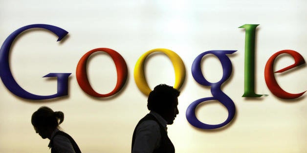 FRANKFURT/MAIN, GERMANY: (FILES)Waiters catering a reception at the Google stand, work in front of a logo of the US search e