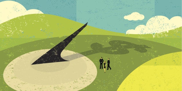 Business people looking at a huge sundial realize that 'Time is Money'. The people are on a separate labeled layer from the b
