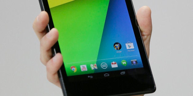 Hugo Barra, vice president Android product management at Google, displays the new Nexus 7 tablet on Wednesday, July 24, 2013, in San Francisco. (AP Photo/Marcio Jose Sanchez)