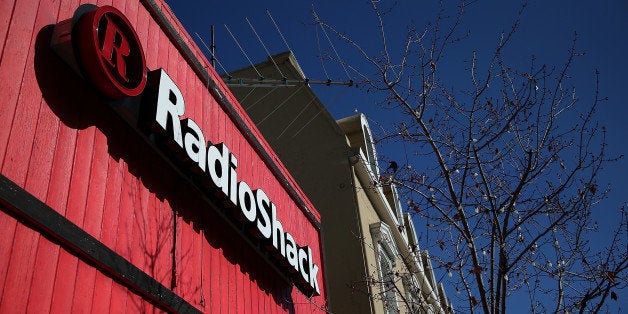 SAN RAFAEL, CA - FEBRUARY 04: A sign is displayed on the exterior of a RadioShack store on February 4, 2014 in San Rafael, California. RadioShack Corp. announced plans to close nearly 500 stores of its electronics stores in the coming months. (Photo by Justin Sullivan/Getty Images)