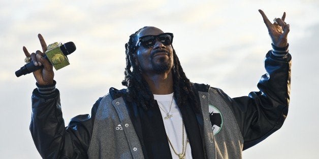 US rapper Snoop Dogg performs during the Grand Journal tv show, on the sidelines of the 68th Cannes Film Festival in Cannes, southeastern France, on May 19, 2015. AFP PHOTO / LOIC VENANCE (Photo credit should read LOIC VENANCE/AFP/Getty Images)