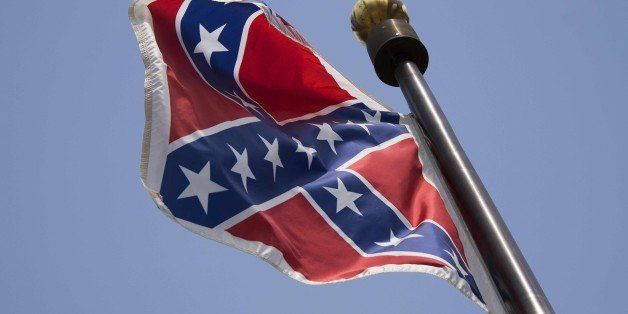 The Confederate Flag flies on the South Carolina State House grounds in Columbia, South Carolina, June 24, 2015. The Confederate battle flag was taken down Wednesday outside Alabama's state legislature as Americans increasingly shun the Civil War era saltire after the Charleston church massacre. AFP PHOTO/JIM WATSON (Photo credit should read JIM WATSON/AFP/Getty Images)