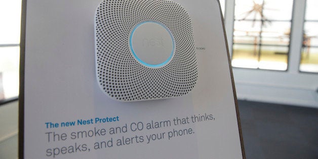 The new Nest Protect smoke and CO alarm is displayed following a news conference Wednesday, June 17, 2015, in San Francisco. Google's Nest Labs is releasing new versions of its surveillance video camera and talking smoke detector as part of its attempt to turn homes into yet another thing that can be controlled and tracked over the Internet. (AP Photo/Eric Risberg)