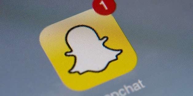 The logo of mobile app 'Snapchat' is displayed on a tablet on January 2, 2014 in Paris. Hackers broke into Snapchat, the huge