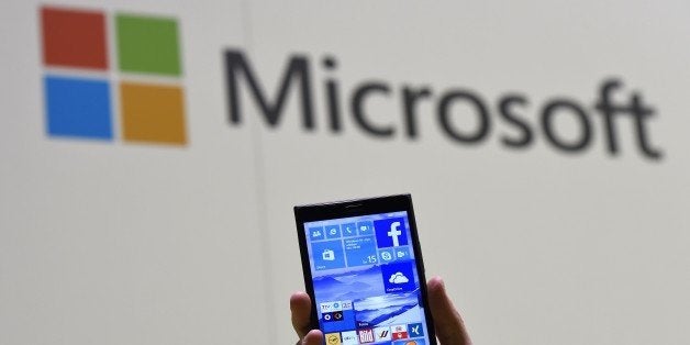 A man shows Microsoft's Windows 10 operating system at the CeBIT technology fair in Hanover on March 15, 2015. The CeBIt run