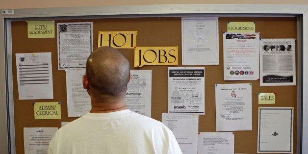 A job seeker checks for new jobs postings at the Glendale Workforce Services Center Thursday, Aug. 19, 2010, in Glendale, Calif. Employers appear to be laying off workers again as the economic recovery weakens. The number of people applying for unemployment benefits reached the half-million mark last week for the first time since November. (AP Photo/Damian Dovarganes)