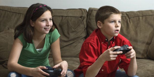 Siblings playing a video game