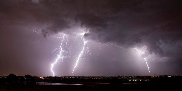 Lightning flashes over the eastern plains over Highlands Ranch, Colorado. The June storm front spun seven tornadoes over east