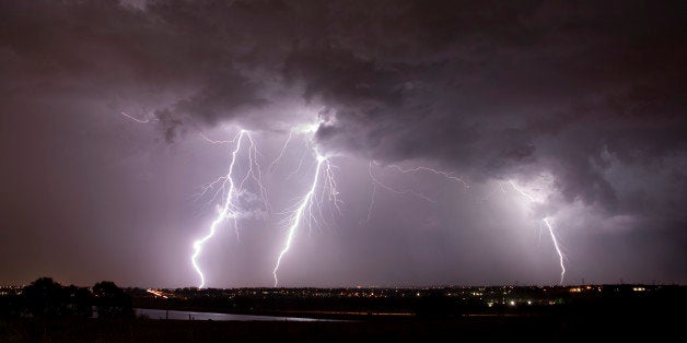 Lightning flashes over the eastern plains over Highlands Ranch, Colorado. The June storm front spun seven tornadoes over eastern Colorado and golf ball and pea sized hail over metro Denver.