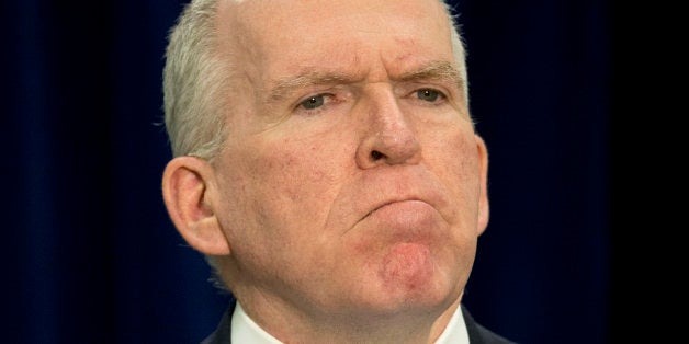 CIA Director John Brennan pauses during a news conference at CIA headquarters in Langley, Va., Thursday, Dec. 11, 2014. Brennan defending his agency from accusations in a Senate report that it used inhumane interrogation techniques against terrorist suspect with no security benefits to the nation. (AP Photo/Pablo Martinez Monsivais)