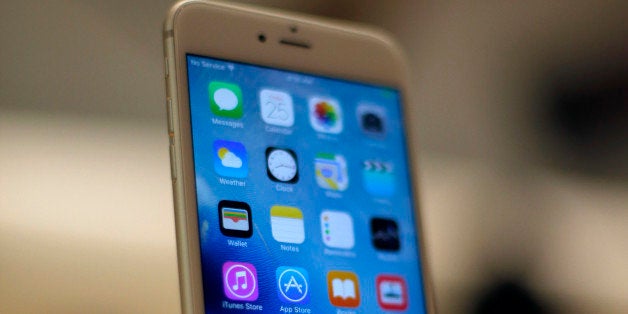 A new Apple iPhone 6S is displayed at an Apple store on Chicago's Magnificent Mile, Friday, Sept. 25, 2015, in Chicago. (AP Photo/Kiichiro Sato)