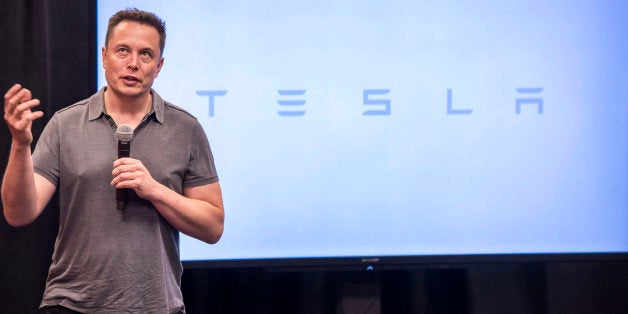 Elon Musk, chairman and chief executive officer of Tesla Motors, speaks during an event the company's headquarters in Palo Alto, California, U.S., on Wednesday, Oct. 14, 2015. Tesla Motors Inc. will begin rolling out the first version of its highly anticipated 'autopilot' features to owners of its all-electric Model S sedan Thursday. Autopilot is a step toward the vision of autonomous or self-driving cars, and includes features like automatic lane changing and the ability of the Model S to parallel park for you. Photographer: David Paul Morris/Bloomberg via Getty Images
