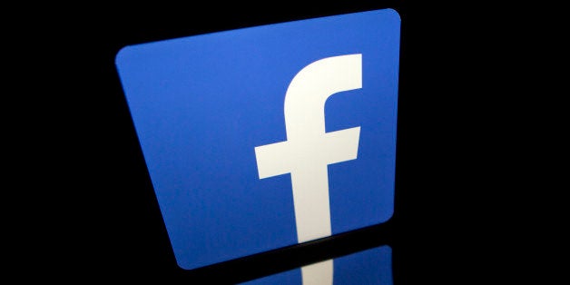 The Facebook Inc. logo is displayed on an Apple Inc. iPad Air in this arranged photograph in Washington, D.C., U.S., on Monda