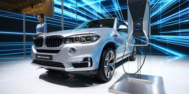 A BMW AG X5 xDrive40e plug-in hybrid vehicle stands on display at the 16th Shanghai International Automobile Industry Exhibition (Auto Shanghai 2015) in Shanghai, China, on Tuesday, April 21, 2015. The Auto Shanghai 2015 will be held through April 29. Photographer: Tomohiro Ohsumi/Bloomberg via Getty Images