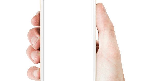 Hand holding smart phone - gold/white color with blank screen