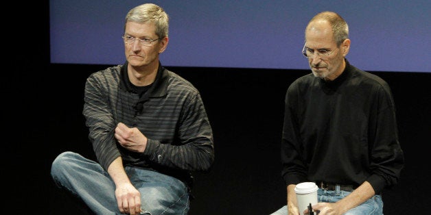 In this July 16, 2010 photo shows Apple's Tim Cook, left, and Steve Jobs, right, during a meeting at Apple in Cupertino, Calif. Cook takes over as CEO for Apple after Jobs resigned. (AP Photo/Paul Sakuma)