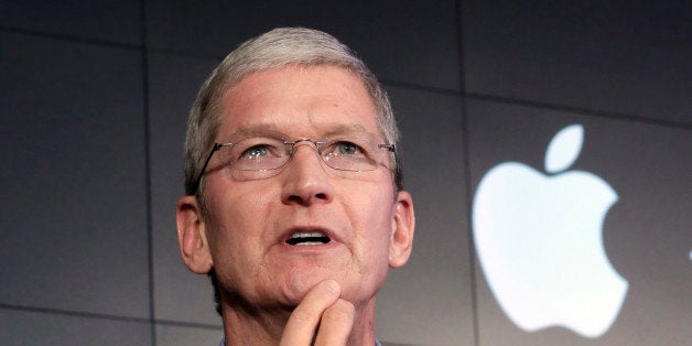 FILE - In this April 30, 2015, file photo, Apple CEO Tim Cook responds to a question during a news conference at IBM Watson h