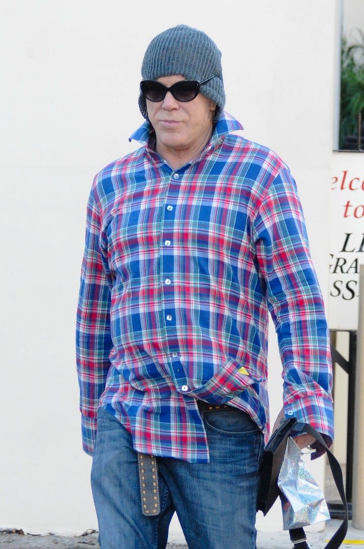 Mickey Rourke shows bizarre style choices with shades worn OVER