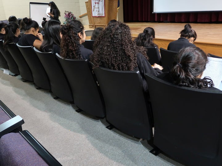 Children apprehended at the U.S. border as unaccompanied minors sit in a Department of Health and Human Services facility in Bristow, Virginia.