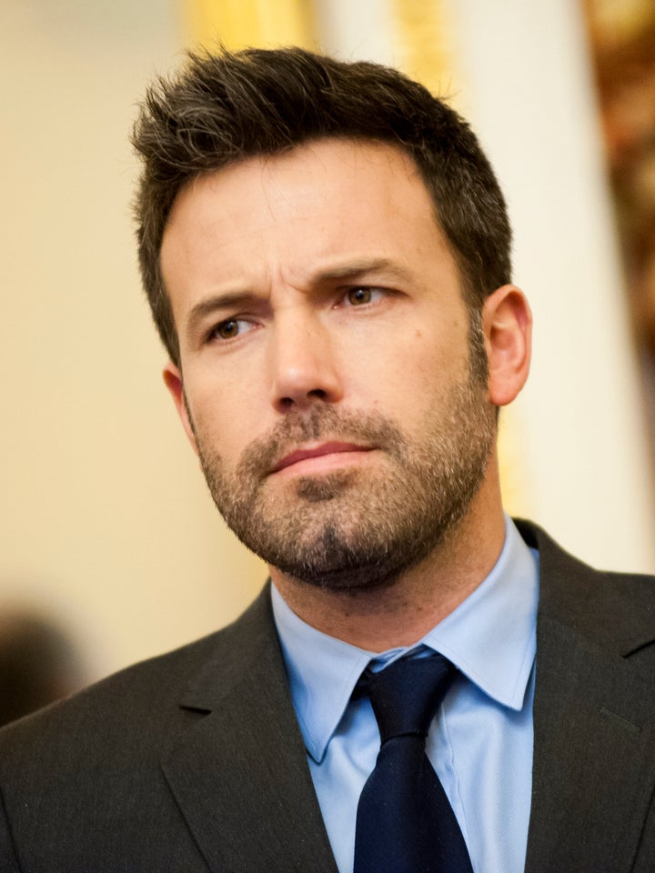 WASHINGTON, DC - DECEMBER 19: Ben Affleck poses for a photo during a meeting with members of the Senate Foreign Relations Com