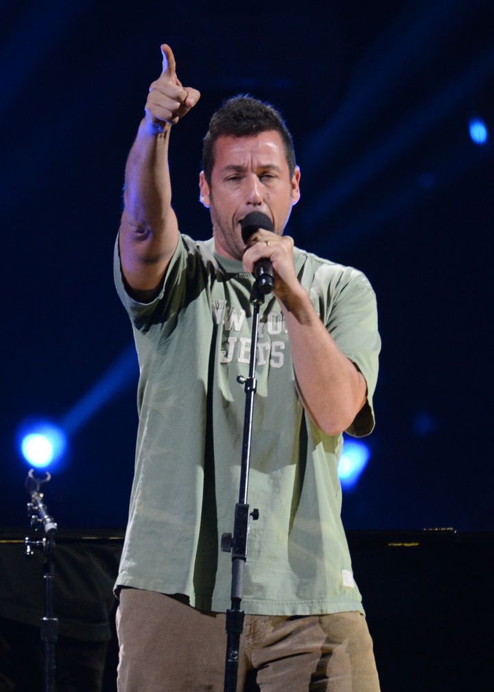 US comedian and actor Adam Sandler performs during '12-12-12 ~ The Concert For Sandy Relief' December 12, 2012 at Madison Square Garden in New York. AFP PHOTO/DON EMMERT (Photo credit should read DON EMMERT/AFP/Getty Images)