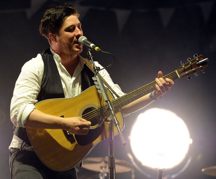 INDIO, CA - APRIL 16: Musician Marcus Mumford of Mumford & Sons performs during Day 2 of the Coachella Valley Music & Arts Festival 2011 held at the Empire Polo Club on April 16, 2011 in Indio, California. (Photo by Kevin Winter/Getty Images)