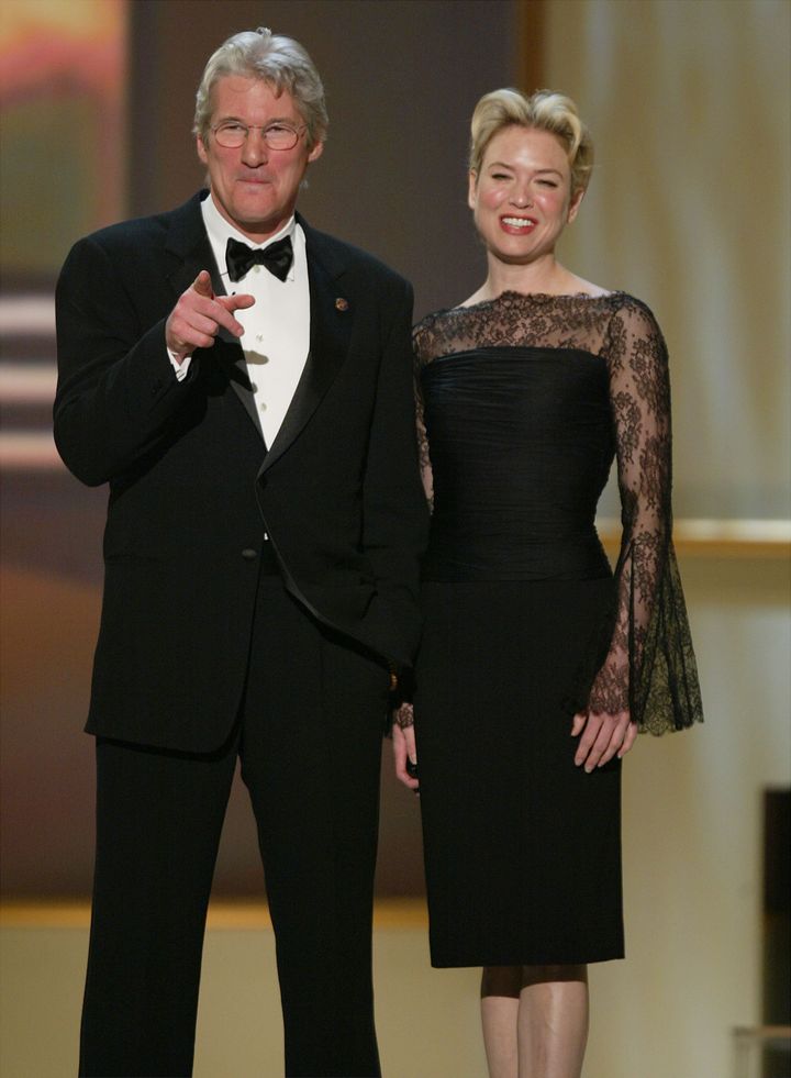 LOS ANGELES - MARCH 9: Actror Richard Gere and actress Renee Zellweger of 'Chicago' speak onstage during the 9th Annual Screen Actors Guild Awards at the Shrine Auditorium on March 9, 2003 in Los Angeles, California. (Photo by Kevin Winter/Getty Images)