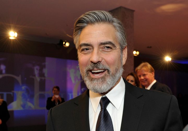 US actor George Clooney smiles as he arrives for the German Media Award (Deutscher Medienpreis) in Baden-Baden, southern Germany, on February 26, 2013. Clooney is awarded for his humanitarian commitment. AFP PHOTO / THOMAS KIENZLE (Photo credit should read THOMAS KIENZLE/AFP/Getty Images)