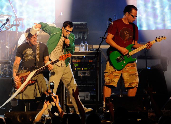LAS VEGAS - OCTOBER 01: (L-R) Weezer bassist Scott Shriner, frontman Rivers Cuomo and guitarist Patrick Wilson perform at the Bare Pool Lounge at The Mirage Hotel & Casino October 1, 2010 in Las Vegas, Nevada. (Photo by Ethan Miller/Getty Images for MGM Resorts International)