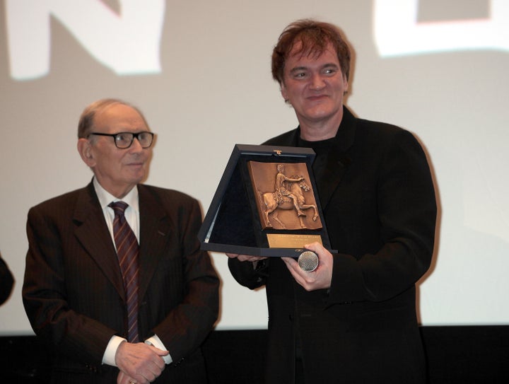 ROME, ITALY - JANUARY 04: Director Quentin Tarantino (R) receives Rome Film Festival Lifetime Achievement Award from Italian