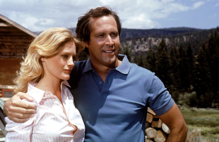UNSPECIFIED - JULY 24: Medium shot of Chevy Chase as Clark Griswold with arm around Beverly D'Angelo as Ellen Griswold. (Photo by Warner Bros./Getty Images)
